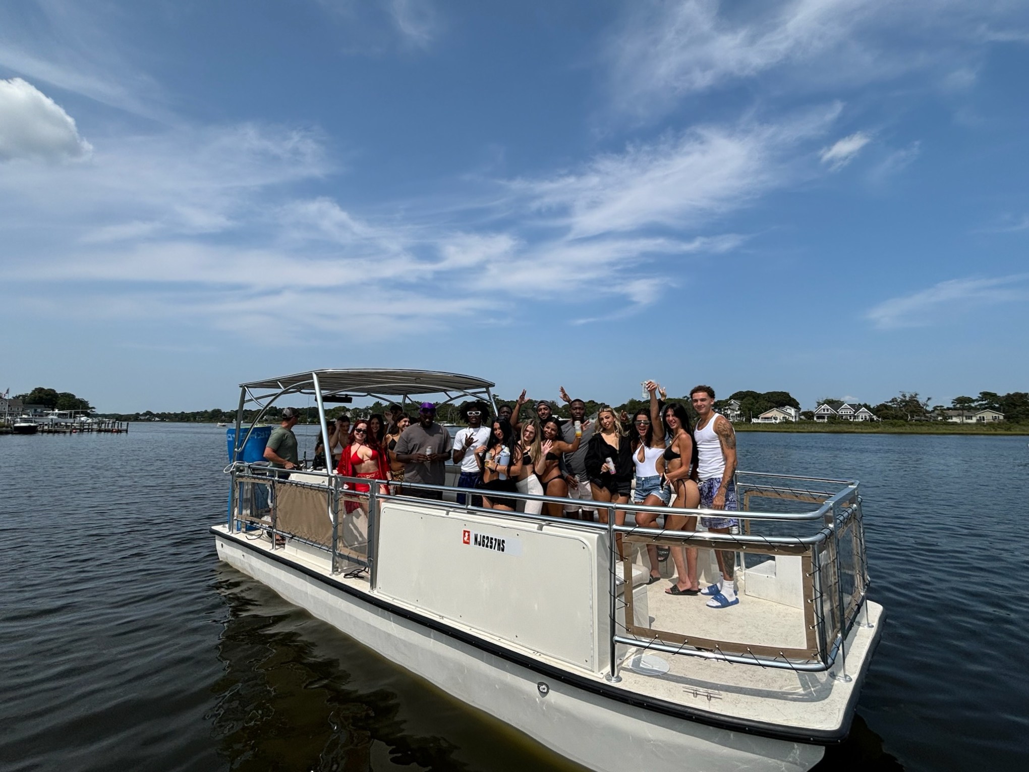 a group of people in a boat on a body of water
