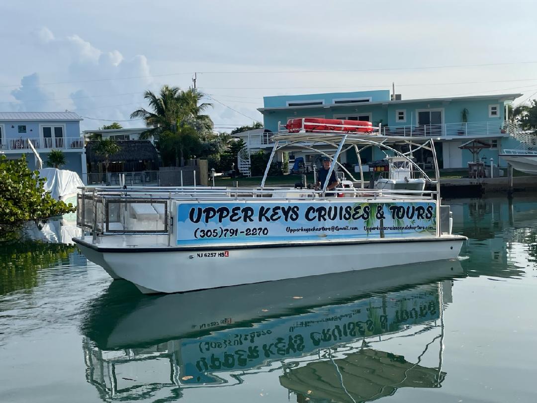 a boat is docked next to a body of water