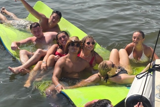 a group of people swimming in a body of water